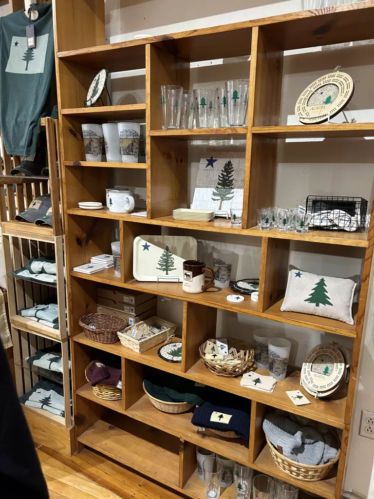 Maine flag themed trinkets and souvenirs on shelves