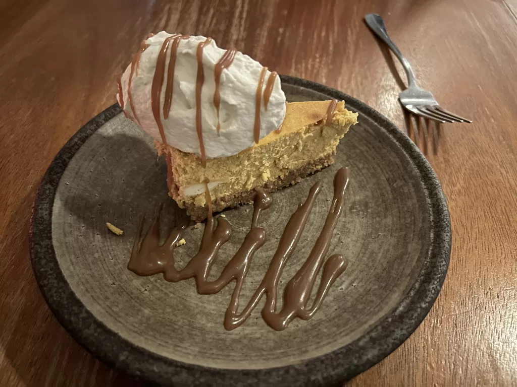 Image of a pumpkin cheesecake on a plate from Fresh & Co. restaurant