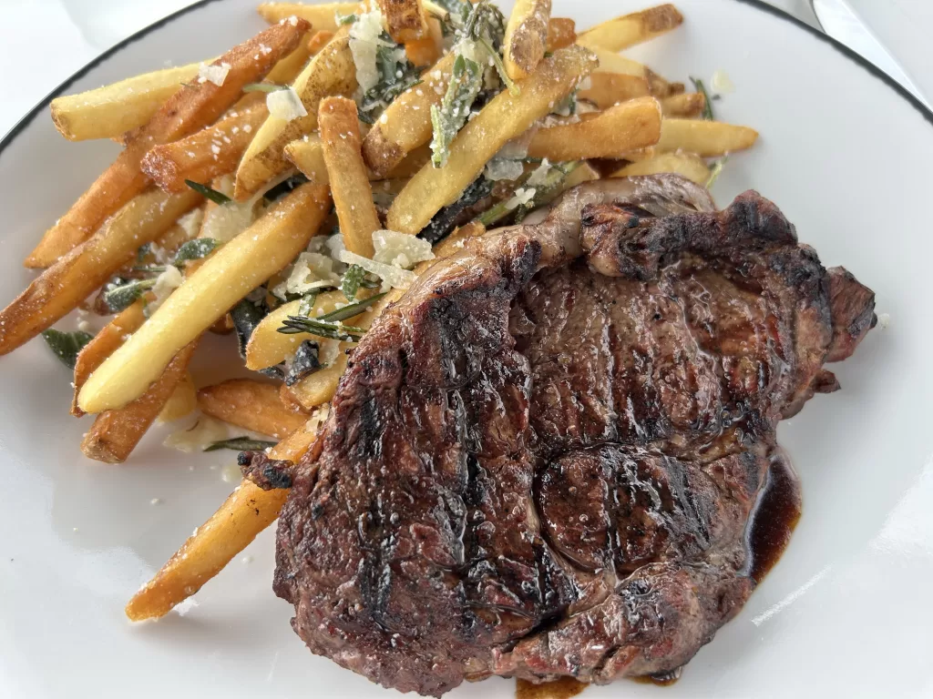 Image of a grilled steak with fries from Grand View Deck restaurant