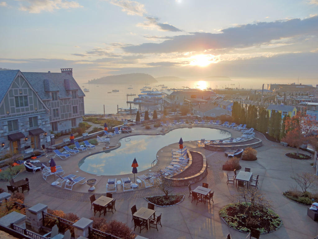 Image of the Harborside Hotel pool and the coast in the background