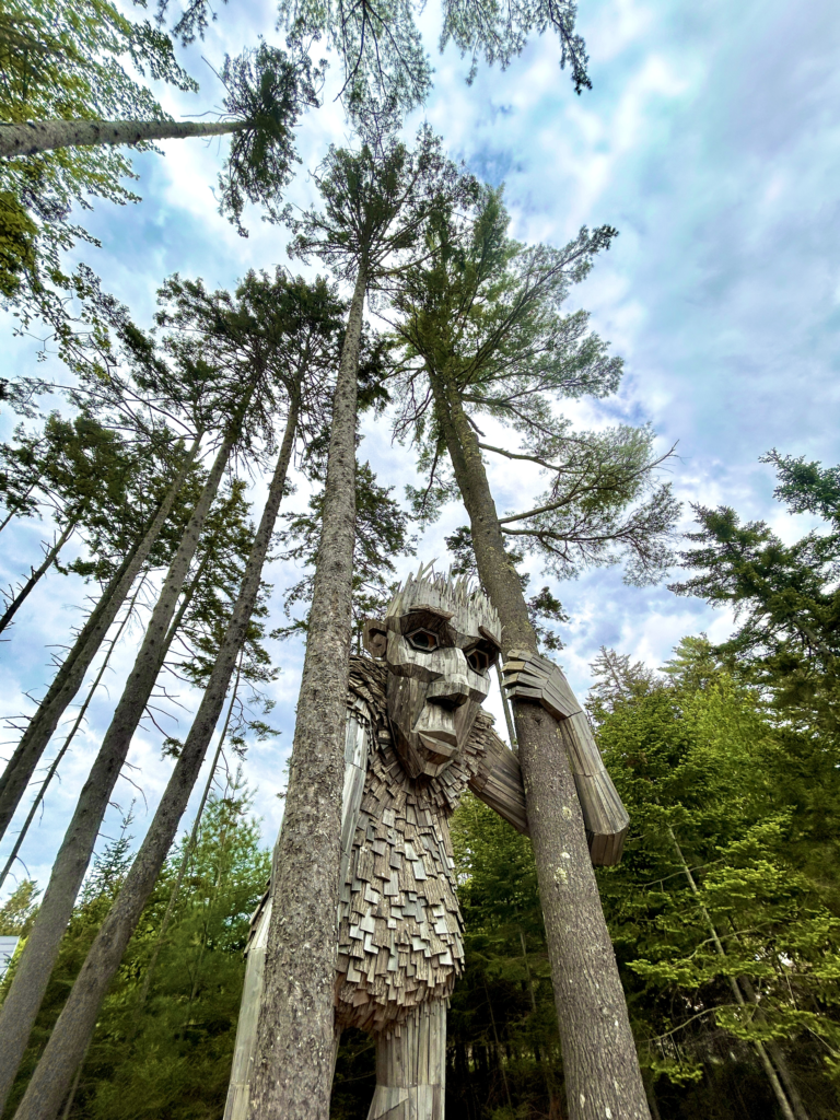 Image of a giant troll in the woods at Coastal Maine Botanical Gardens